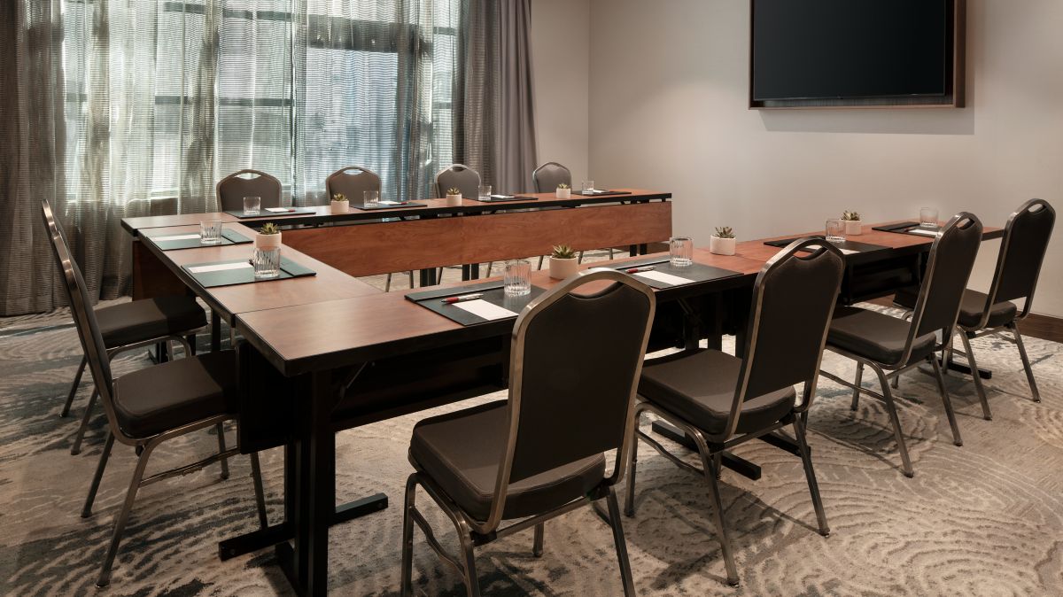A Las Vegas Marriott meeting room arranged in a U-shape setup with windows and natural light